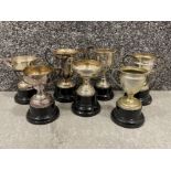 7 x small silver plated trophies on bases