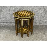 Very ornate and heavily inlaid Middle Eastern/Indian table with chess board atop and storage under