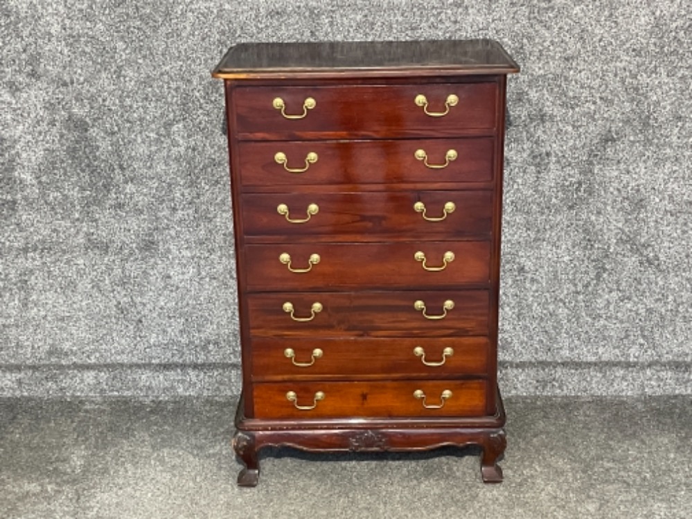 Vintage mahogany 7 drawer chest of drawers on carved base with feet.