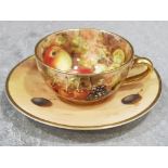 Royal Worcester handpainted associated miniature tea cup and saucer signed Roberts on the saucer (