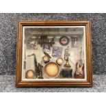 Framed display of Jazz themed items