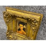 Heavily decorative framed picture of a Spanish maiden