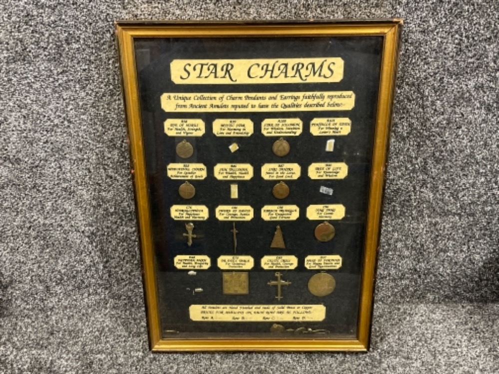 Framed collection of Star charms (all present)