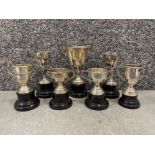 7 small silver plated trophies