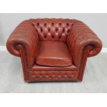 Metal studded red leather chesterfield club chair