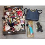 Large amount of 20th century souvenir dolls together with a Dice ladies shoulder bag