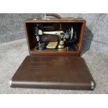 A vintage Singer sewing machine EB 606093, cased.