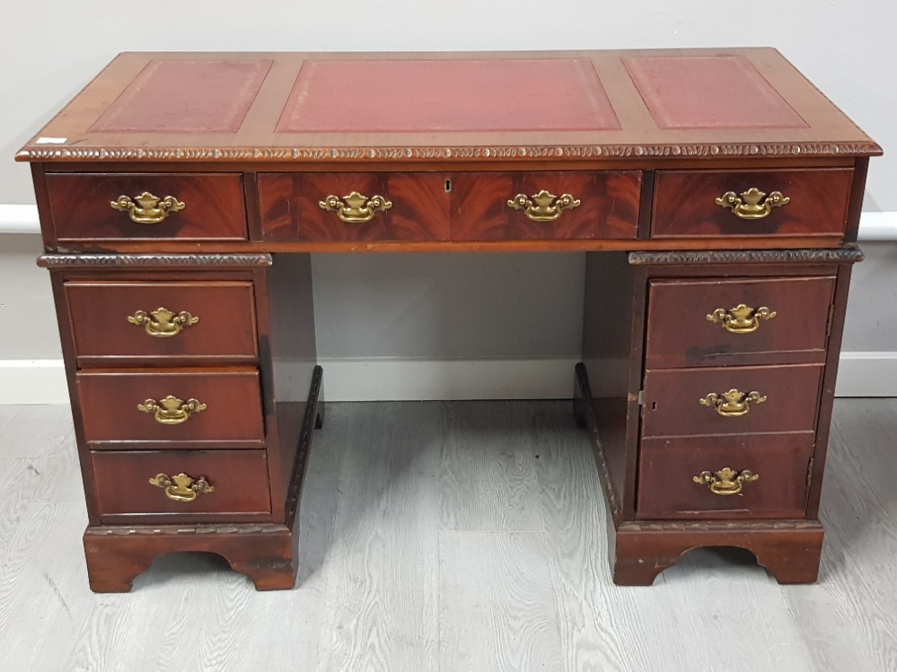 Flame mahogany twin pedestal desk with red leather top & brass handles