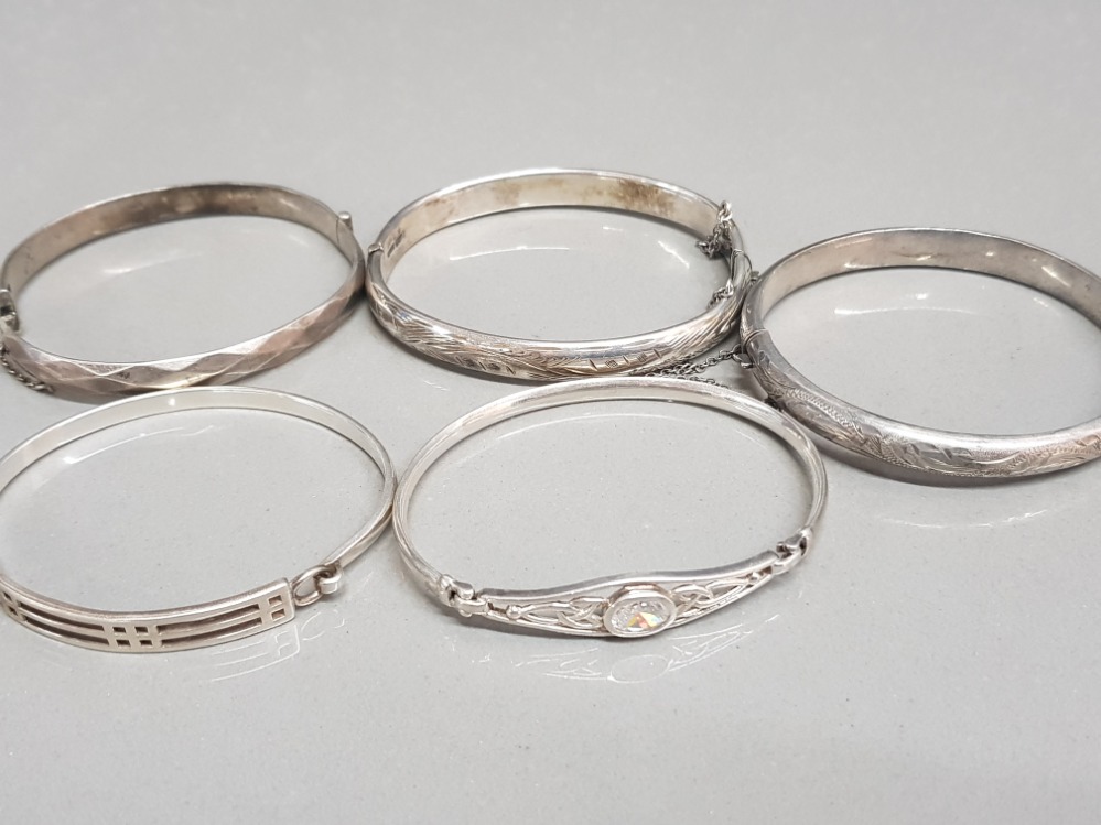 5 x ladies silver bangles, 3x hollow patterned bangles with safety chains, 1x ornate celtic design