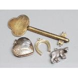 4 silver items includes horseshoe & heart shaped locket pendants, bear pendant and key, 18.9g gross