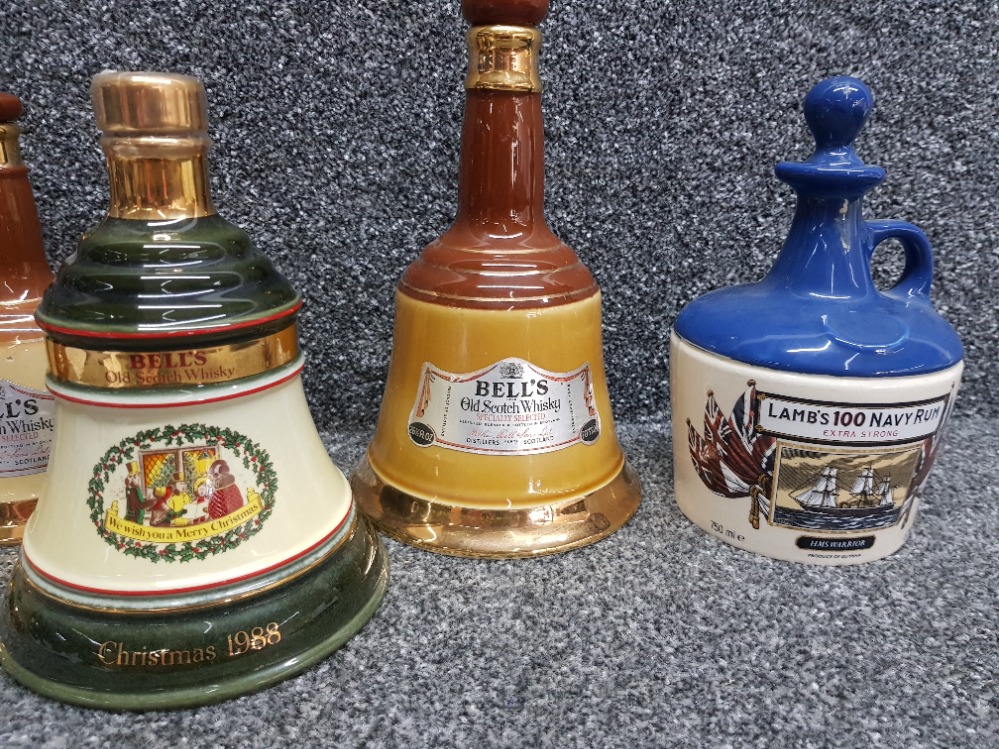 Five Bells scotch whisky decanters and a Lamb's 100 navy rum decanter, all empty. - Image 2 of 3