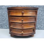 A mahogany miniature chest of drawers raised on bun feet 22 x 24 x 17.5cm