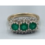 Ladies 9ct gold green stone and diamond ring. Featuring 22 round brilliant cut diamonds. 3.9g size