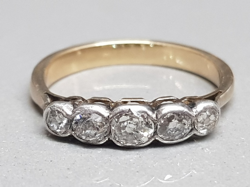 Ladies 9ct yellow gold 5 stone diamond ring, comprising of 5 old cut diamonds set in a rub over