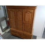 Large pine triple door wardrobe fitted with 5 drawers below, with key, 157x64cm, height 209cm