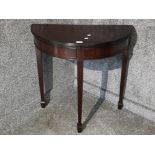 A reproduction mahogany demi-lune hall table 76 x 76 x 38cm