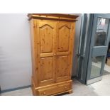 Large heavy pine double door wardrobe fitted with single drawer, with key, 103x64cm, height 195cm