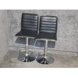 Pair of adjustable bar stools, upholstered with black leatherette seats