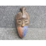 Mid 20th century Ivory Coast hand carved wooden tribal mask