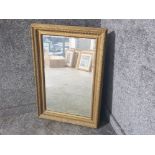 Gilt framed bevelled edge rectangular shaped mirror, 62.5x91cm