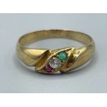 Ladies 14ct gold 3 stone ring. Comprising of Green white and red. 2g size P
