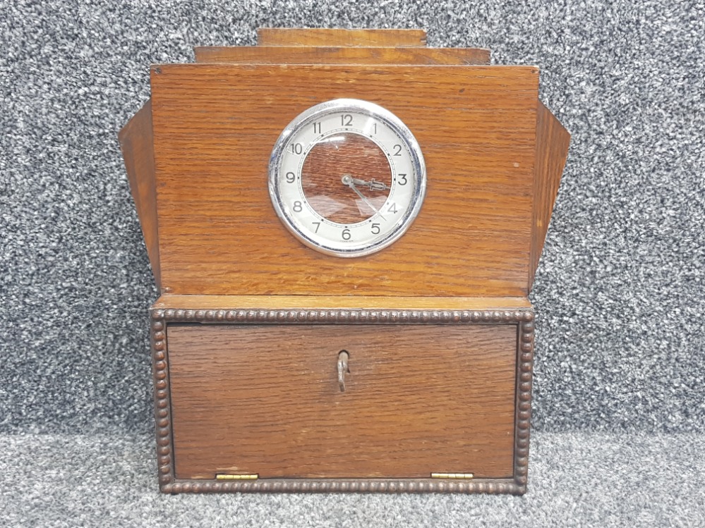 Oak Art Deco clock with storage section beneath, with key