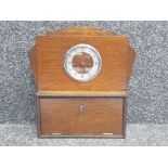 Oak Art Deco clock with storage section beneath, with key