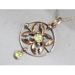 9ct gold ladies ornate peridot pendant & chain, comprising of a ornate pendant set with 2 round