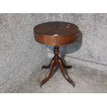 A reproduction mahogany drum table by N Norman Ltd two single drawers and two dummy drawers 49.5cm