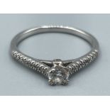 Ladies 9ct white gold diamond ring. Comprising of a Round brilliant cut diamond in centre with 6