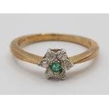 Ladies 9ct yellow gold emerald & diamond cluster ring, round emerald to centre surrounded by six