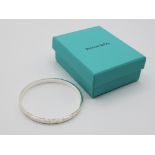 A Tiffany & Co silver bangle 26.47g with original box