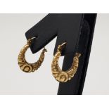 A pair of 9ct yellow gold vintage hoop earrings .74g