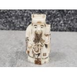 Japanese handcarved bone Netsuke in the form of a village elder with scroll