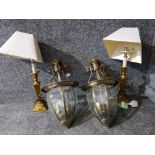 A pair of brass table lamps and a pair of brass and bevelled glass hall lantern style light