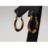 A pair of 9ct yellow and rose gold gypsy style hoop earrings 1.42g