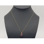 9ct yellow gold garnet & diamond cluster pendant with 9ct chain, 2.4g gross