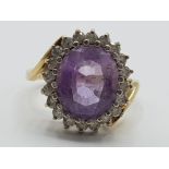 Ladies 9ct yellow gold pink/purple cubic zirconia cluster ring featuring an oval stone set in the