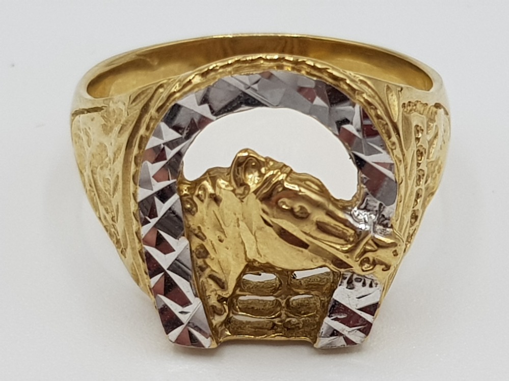 A gents 10ct yellow and white gold dress ring of horse shoe and horse head design size V 6.4g