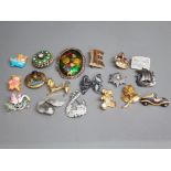 Selection of enamelled and other brooches in the form of a swan, dachshund teddies etc