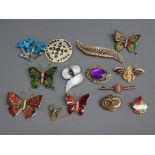 Selection of enamelled and other brooches in the form of butterflies other insects flowers etc