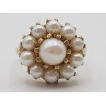 Ladies 9ct yellow gold pearl cluster ring, comprising of 1 large pearl set in the centre