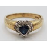 Ladies 9ct yellow gold sapphire and diamond cluster ring, set with black heart shaped sapphire in