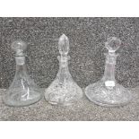 Two cut glass ship's decanters and another ship's decanter.