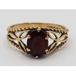 A 9ct yellow gold and garnet fancy ring size M1/2 2.26g gross