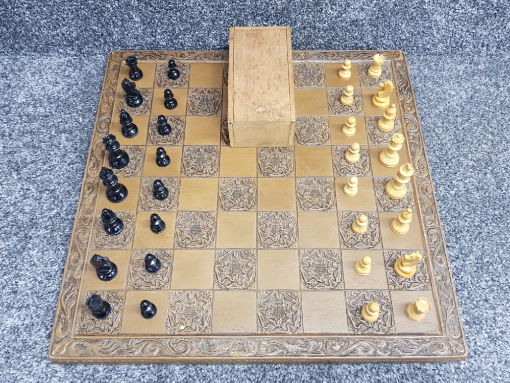 Carved wooden chess board + wooden pieces, complete with slide top storage box