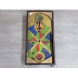 Wooden bagatelle board with native American.