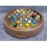 Oak turned solitaire board with marbles