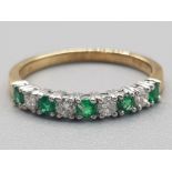 Ladies 18ct yellow gold emerald & diamond band ring comprising of 5 round brilliant cut Emeralds & 4
