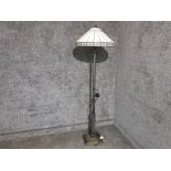 A Tiffany style standard lamp with cream shade.